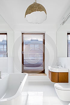 White bathroom with bathtub