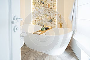White bathroom with big window and big bathtube photo