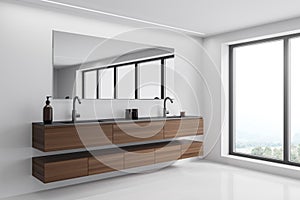 White bathroom with dark wood vanity. Corner view