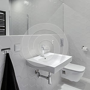 White bathroom with hexagonal tiles