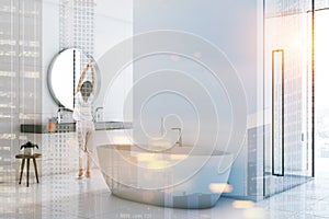 White bathroom inteiror, tub and shower toned