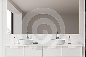 White bathroom interior with double sink