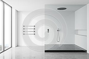 White bathroom interior with shower stall