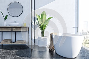 White bathroom interior, white tub and sink