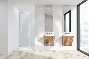 White bathroom with sink and shower