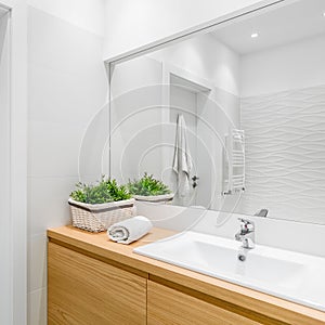 White bathroom with structural tiles