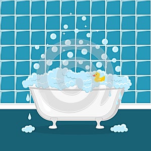 White bathtub with foam, bubbles and yellow duck
