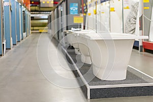 White bathtubs in a hardware store