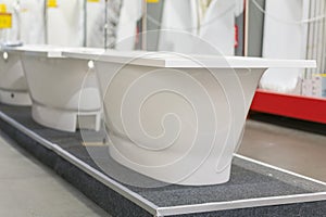 White bathtubs in a hardware store