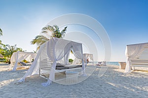 White beach canopies. Luxury beach tents at tropical resort, luxurious vacation and holiday concept t