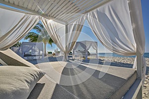 White beach canopies. Luxury beach tents at tropical resort, luxurious vacation and holiday concept t