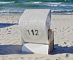 White beach chair with the number 112