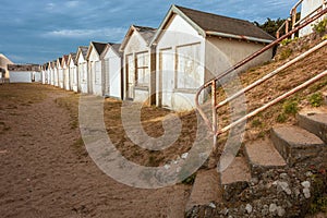 White beach huts in a row