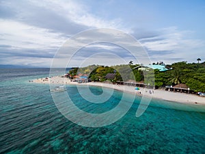 White Beach Moalboal in Cebu, Palawan, Philippines. Boat and Ocean Water and Beach.