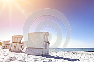 white beach recliners Ahrenshoop Germany sun flare effect
