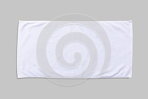 White beach towel mock up isolated with clipping path on grey background, flat lay top view