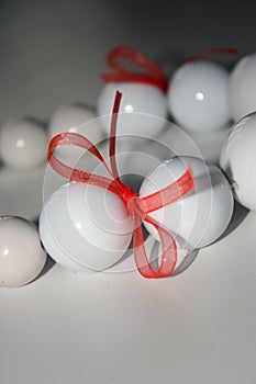 White beads with ribbon