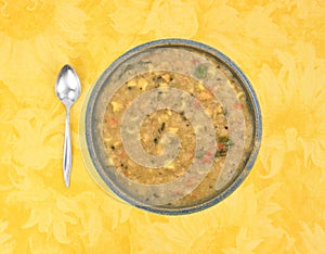 White bean soup in bowl with spoon