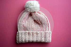 White beanie mockup, solid color background, flat lay, front view