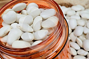 White beans in jar on table