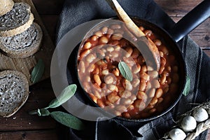 White beans in tomato sauce and herbs.