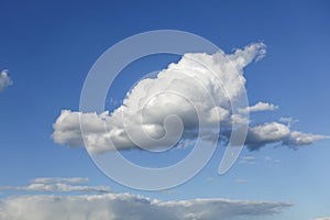 White beautiful lonely cloud on a blue sky