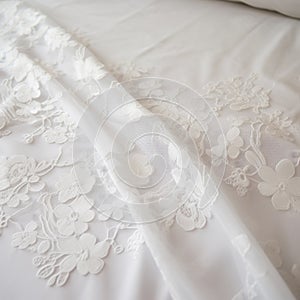 White Floral Embroidered Bed With Tokina Opera 50mm F14 Ff Style photo