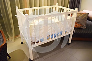 white bed for child and baby at hotel room