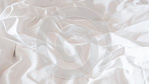 White bed sheet blanket, wrinkled duvet, crumpled comforter cloth used in hotel, resort or home interior for bedding background