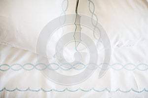 White bed sheets on bed