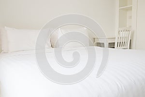 White bed sheets and pillows photo