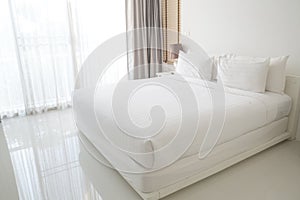 White bed sheets and pillows photo