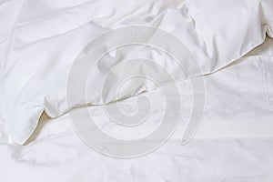White bedding. Crumpled blanket, background