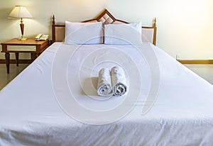 White bedding sheet and white pillows in bedroom