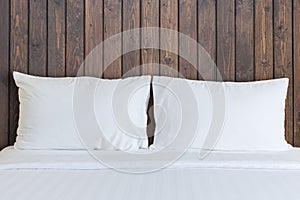 White bedding sheets and pillow in hotel room