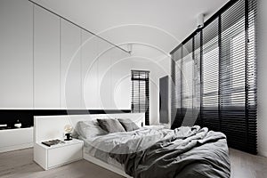 White bedroom with big windows