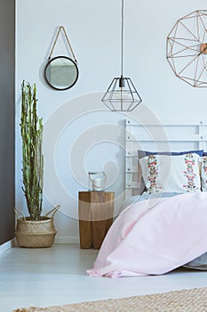 White bedroom with folk pillows