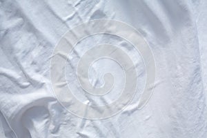 White bedsheet drying in the sun, Wrinkled texture, Abstract background, Close up shot, Select focus, Housework, Laundry photo