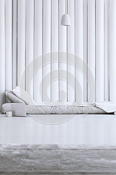 White bedsheets on gray bed