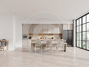 White and beige kitchen interior with table