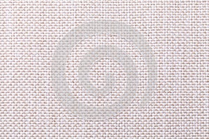 White and beige textile background with checkered pattern, closeup. Structure of the fabric macro.