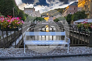 The white bench on the bridge in Karlovy Vary