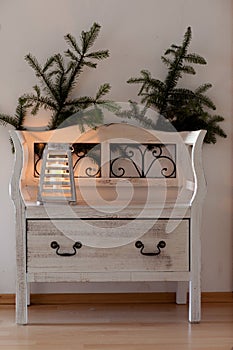 White bench with christmas sprig