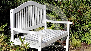 White bench in the garden, resting place