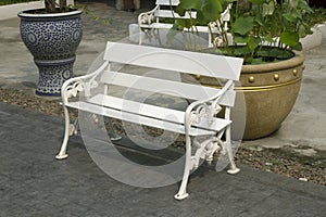 A white bench in the park for sitting and relaxing