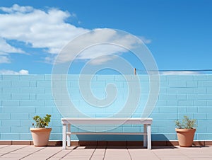 a white bench sitting in front of a blue brick wall