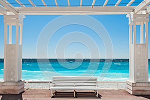 White benches on the Promenade des Anglais in Nice, France photo