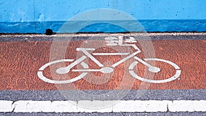 White bicycle drawing symbol on road, lane of cyclists