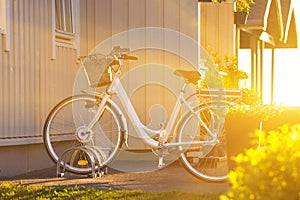 White Bicycle Near The House At Sunset, Norway