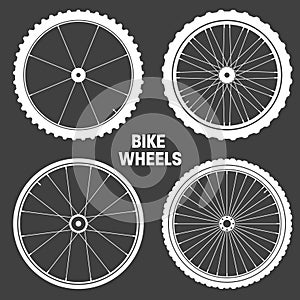 White bicycle wheel symbols collection. Bike rubber tyre silhouettes. Fitness cycle, road and mountain bike. Vector